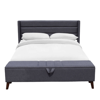 Le lit de rangement gris solide à dos tufté est confortable pour dormir
